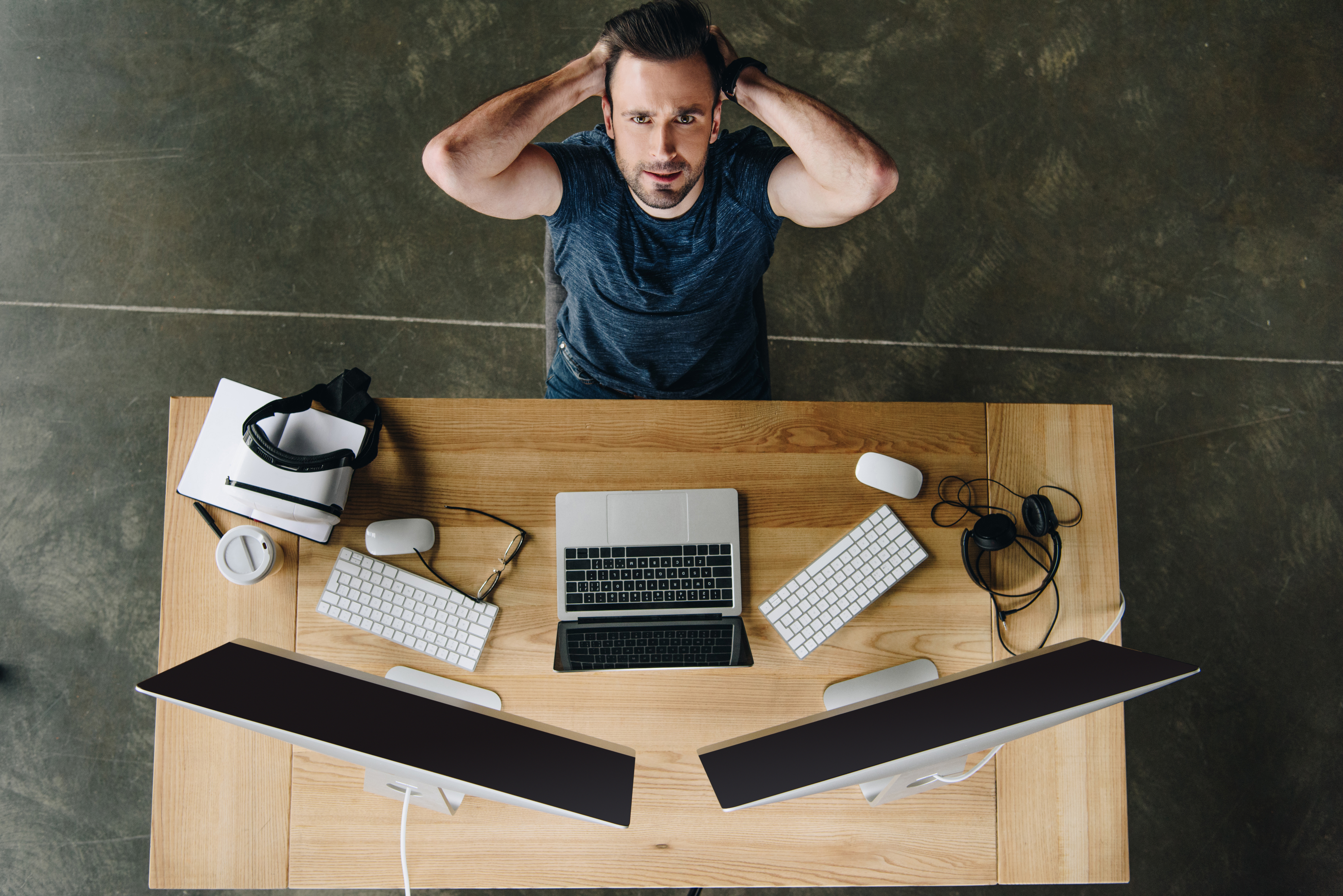 Man lying back in his chair looking stressed after things have gone wrong