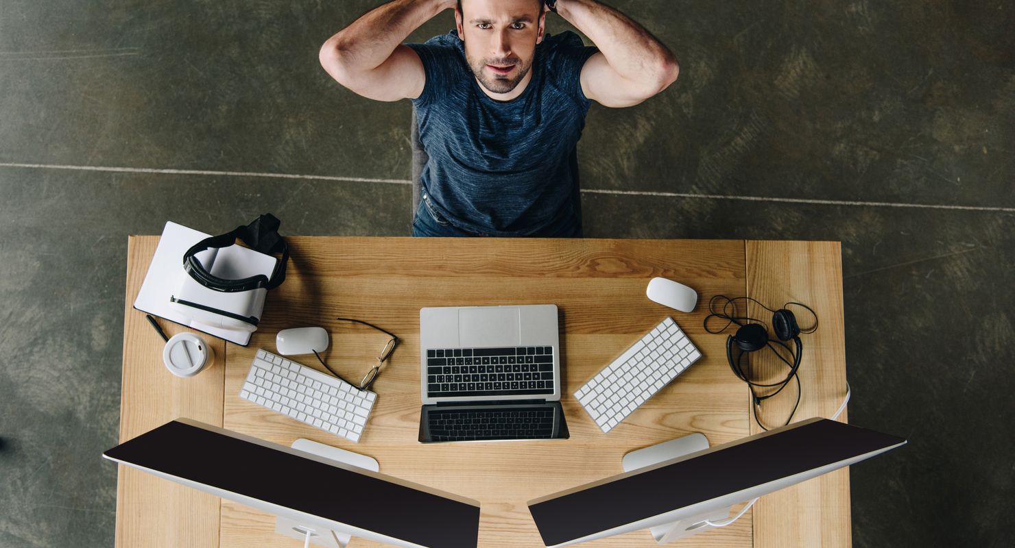 Man lying back in his chair looking stressed after things have gone wrong