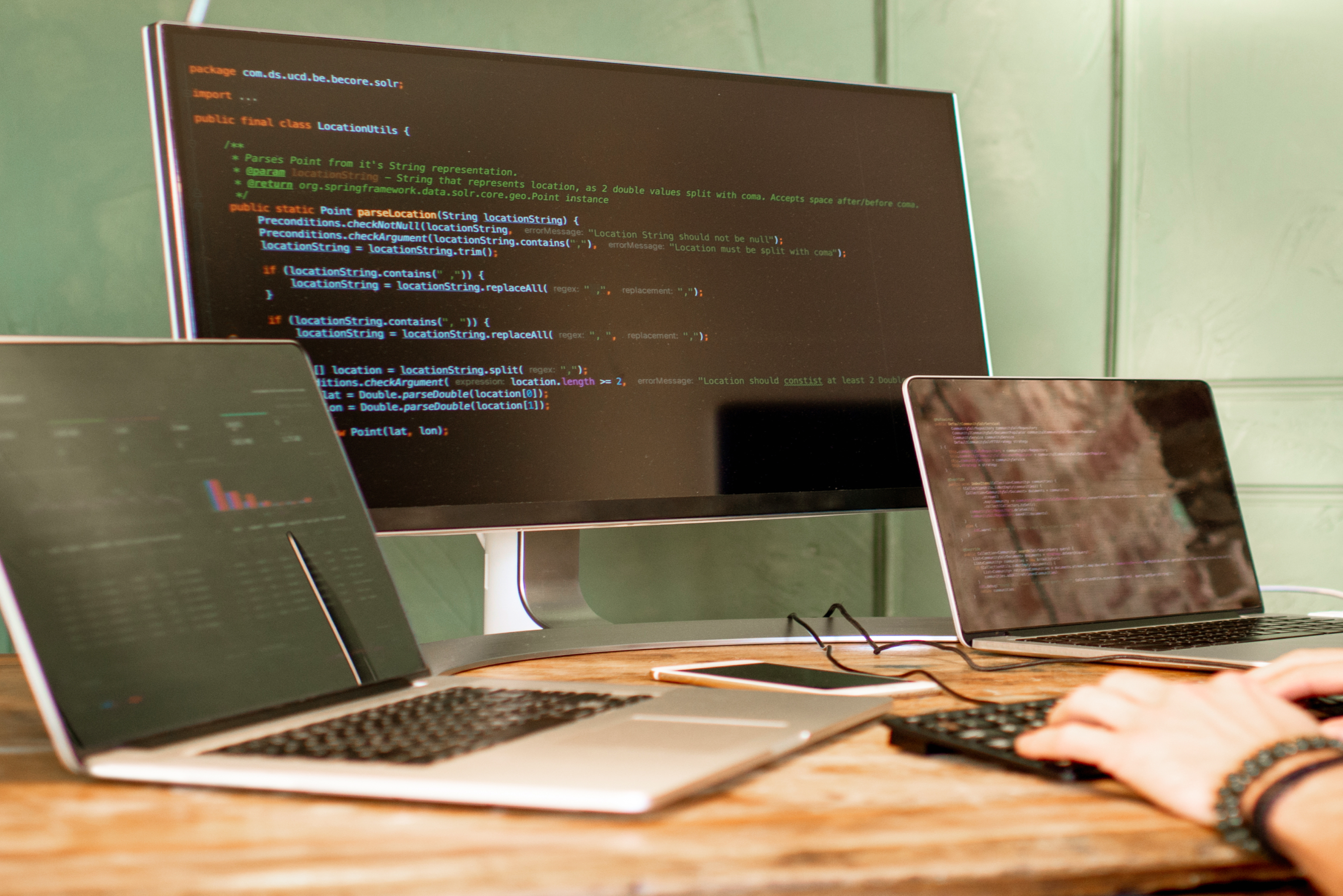 An array of laptops showing code