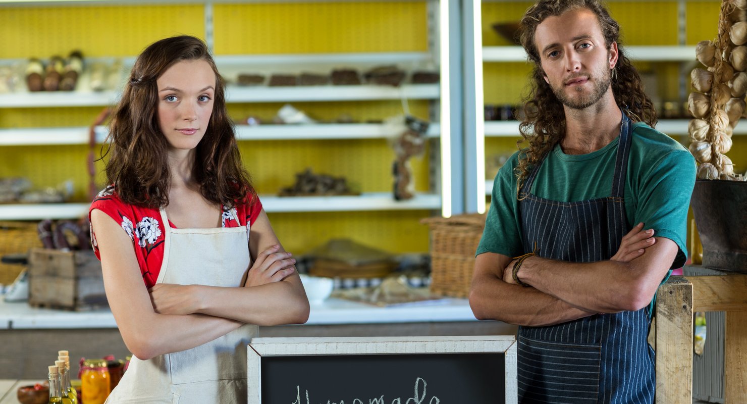 Business owners standing with their arms crossed