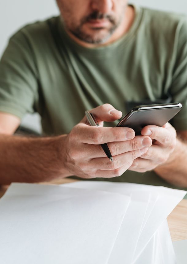 a man planning his finances on his phone